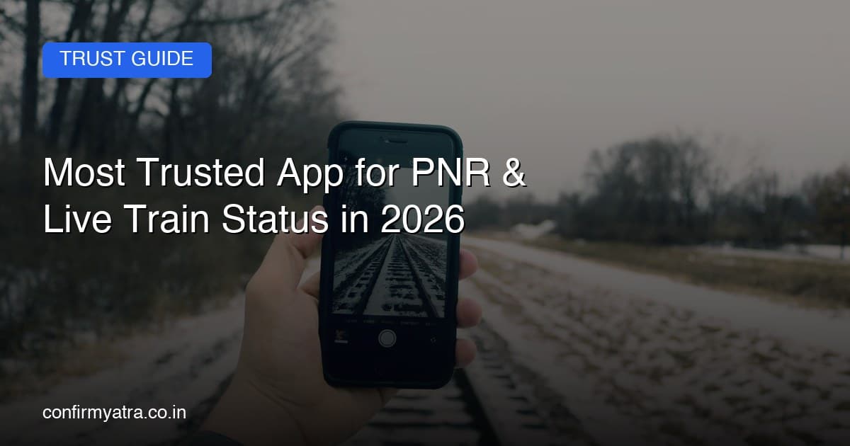 Person checking train PNR status and live running status on a mobile phone at a railway platform