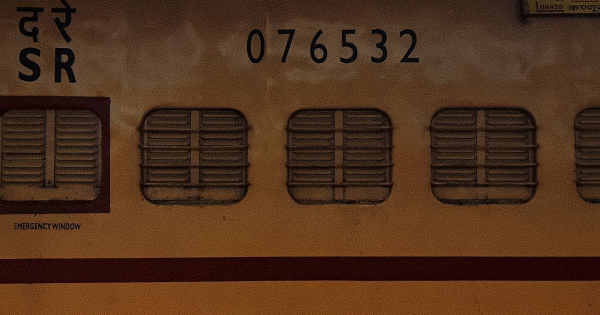 Side view of Indian railway train carriage at station