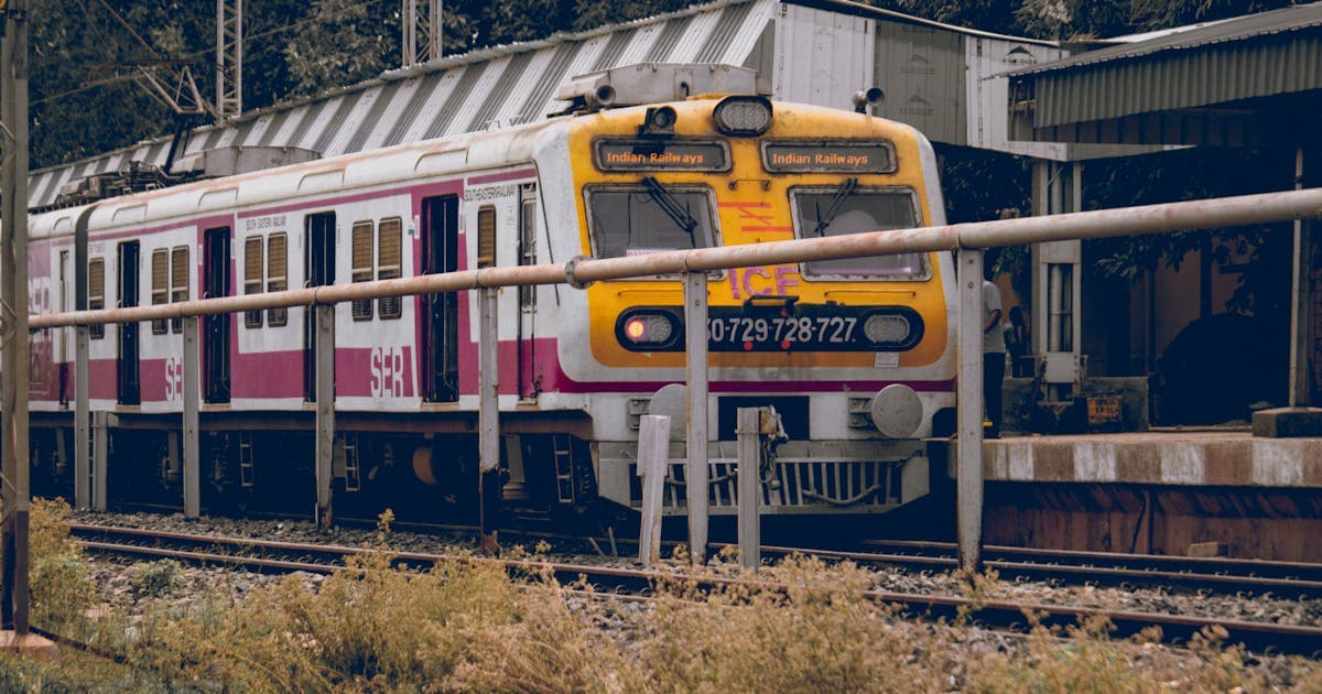 Front view of Indian train arriving at railway platform