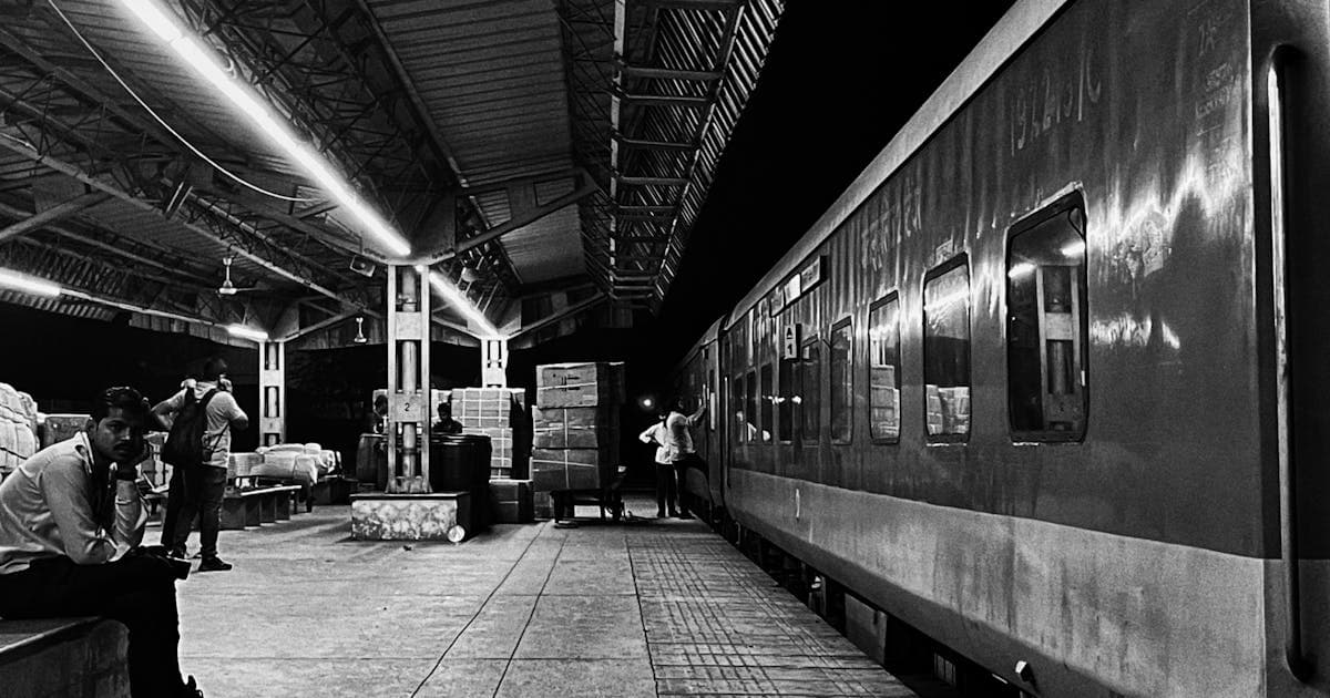 Night scene at Indian railway station platform with lights