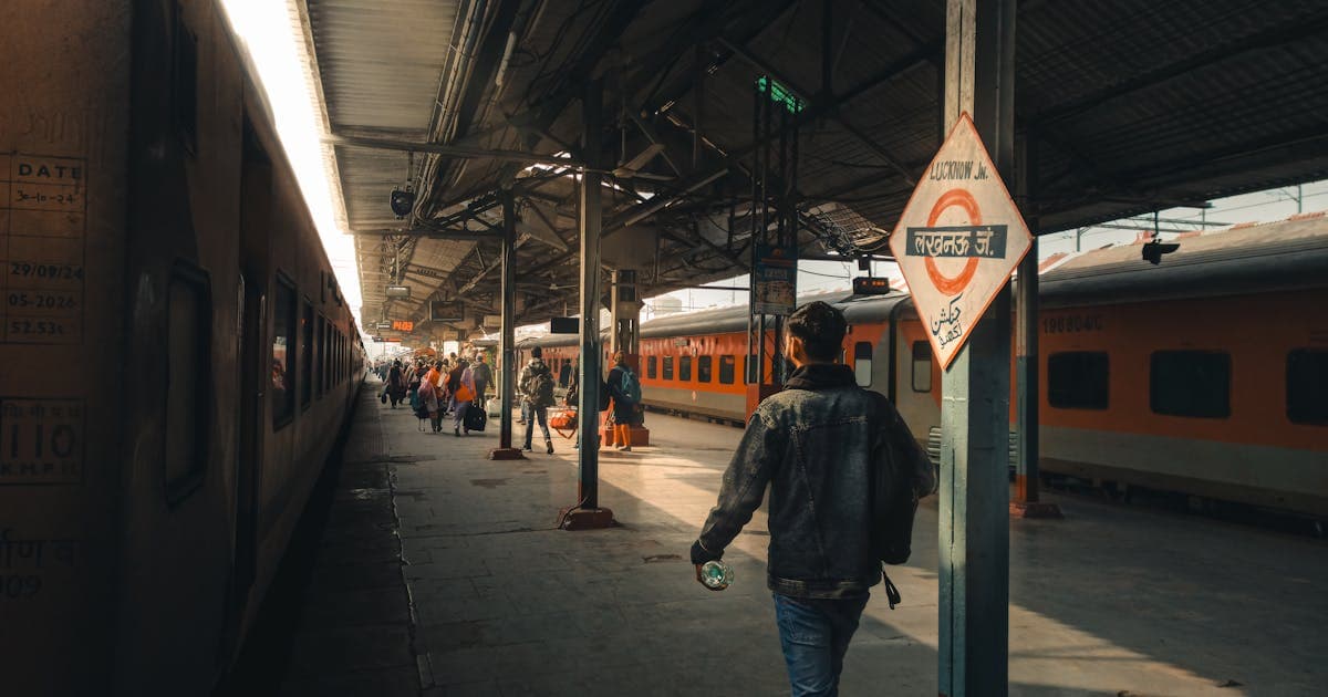 Busy Indian railway station with passengers looking for affordable train tickets