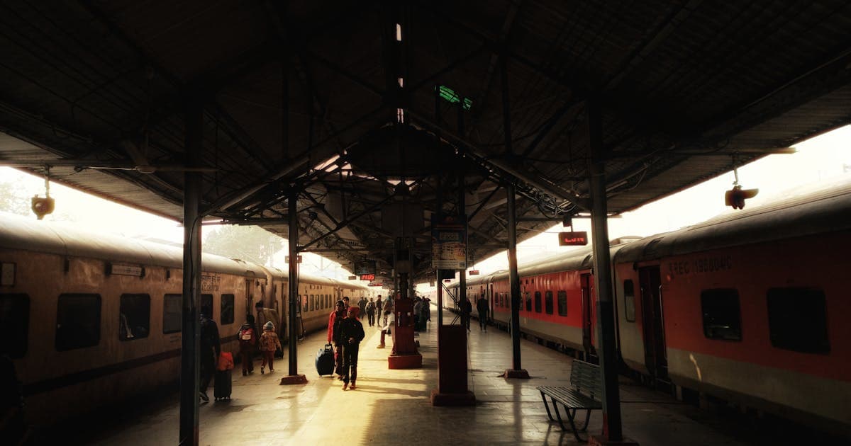 Bustling platform at Lucknow Railway Station during peak booking hours