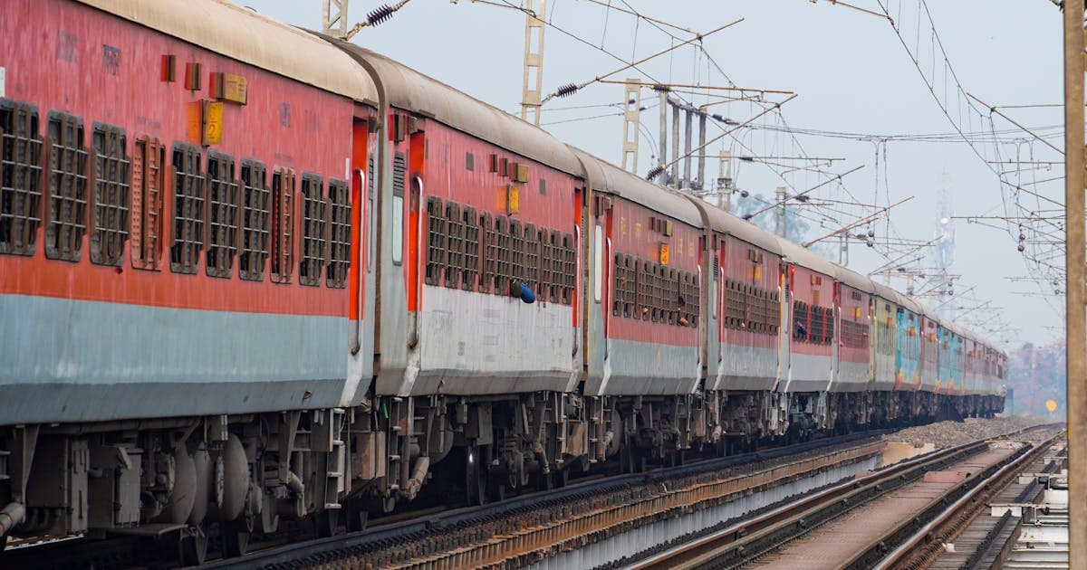 Indian passenger train running on tracks