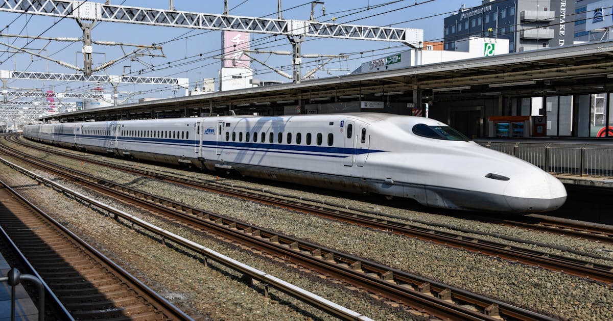 Modern white high-speed electric train representing Vande Bharat Express